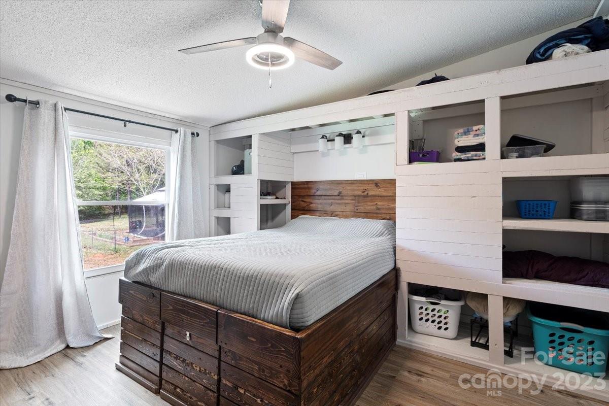 1785 Churchill Road Connelly Springs, NC 28612 - Photo 11 of 27 a bedroom with a large bed and a window