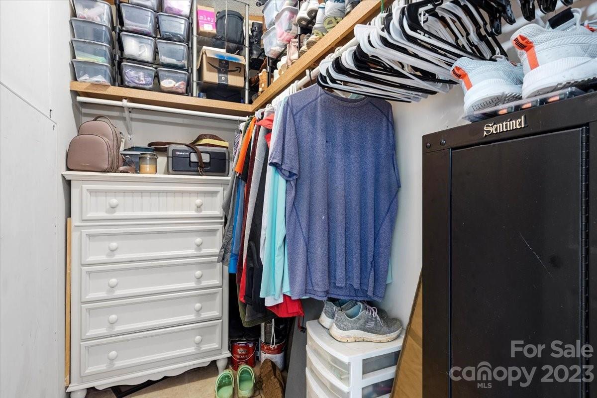 1785 Churchill Road Connelly Springs, NC 28612 - Photo 16 of 27 a view of walk in closet with clothes and shoes