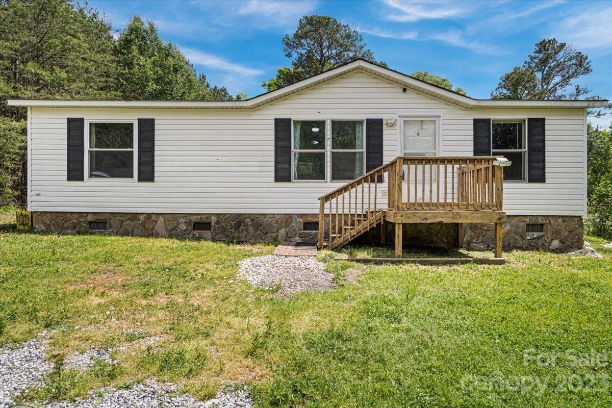 1785 Churchill Road Connelly Springs, NC 28612 - Photo 2 of 27 front view of a house with a yard