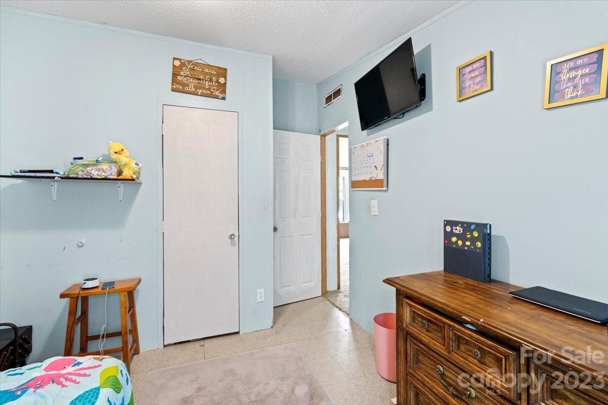 1785 Churchill Road Connelly Springs, NC 28612 - Photo 21 of 27 a room with storage and utility