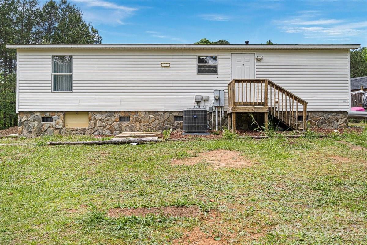 1785 Churchill Road Connelly Springs, NC 28612 - Photo 23 of 27 a front view of a house with garden