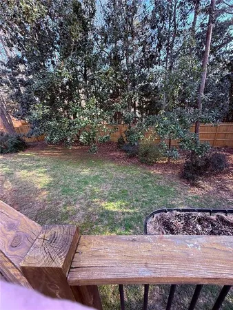 a view of a backyard with table and chairs
