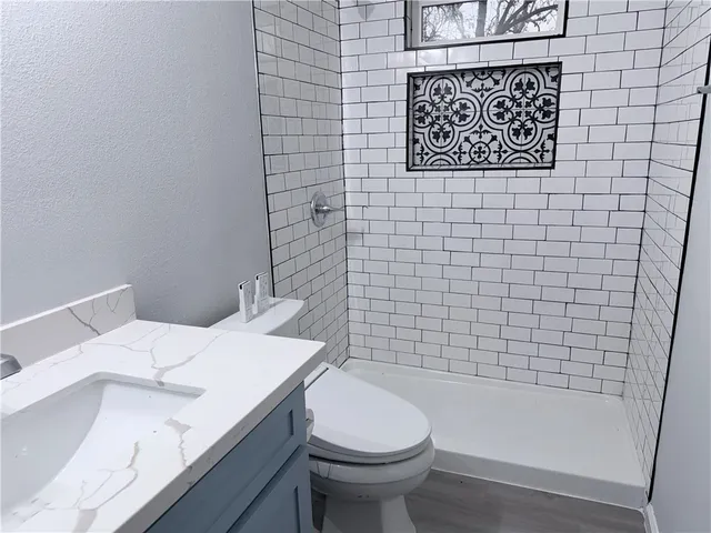 a bathroom with a toilet and a sink