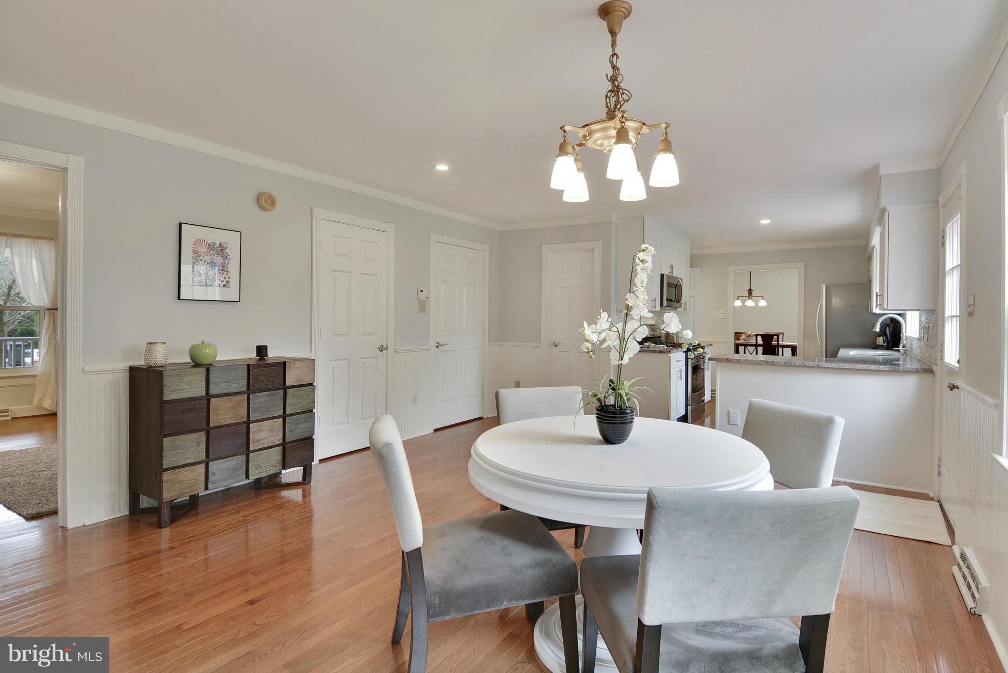 2811 Rifle Ridge Road Oakton, VA 22124 - Photo 8 of 30 a view of a dining room with furniture and wooden floor
