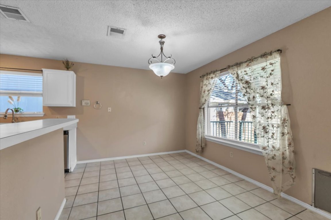 12717 Modena Trail Austin, TX 78729 - Photo 12 of 30 a view of an empty room with a window