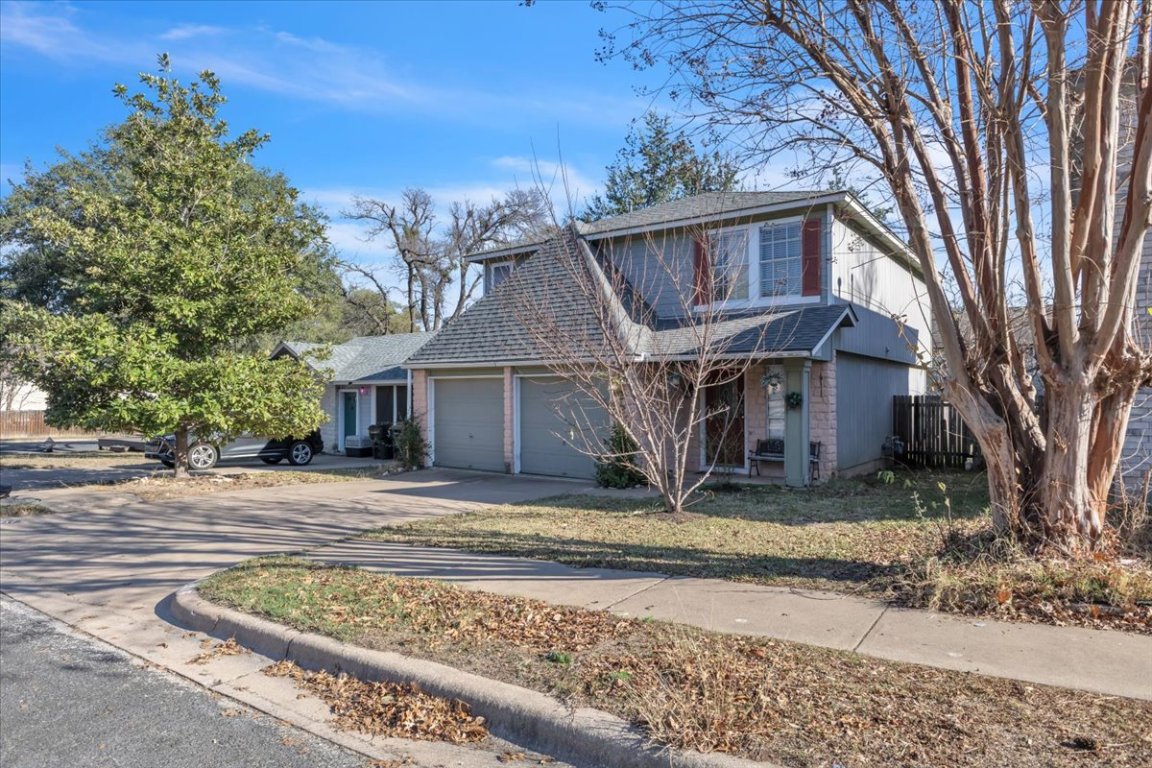 12717 Modena Trail Austin, TX 78729 - Photo 2 of 30 a view of a house with a yard