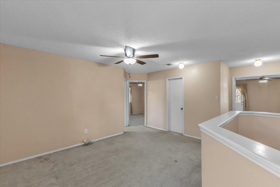 12717 Modena Trail Austin, TX 78729 - Photo 21 of 30 a view of a livingroom and a chandelier