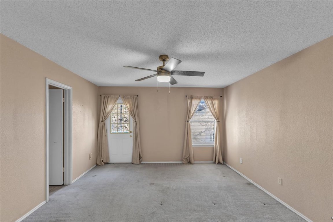 12717 Modena Trail Austin, TX 78729 - Photo 22 of 30 an empty room with windows and closet