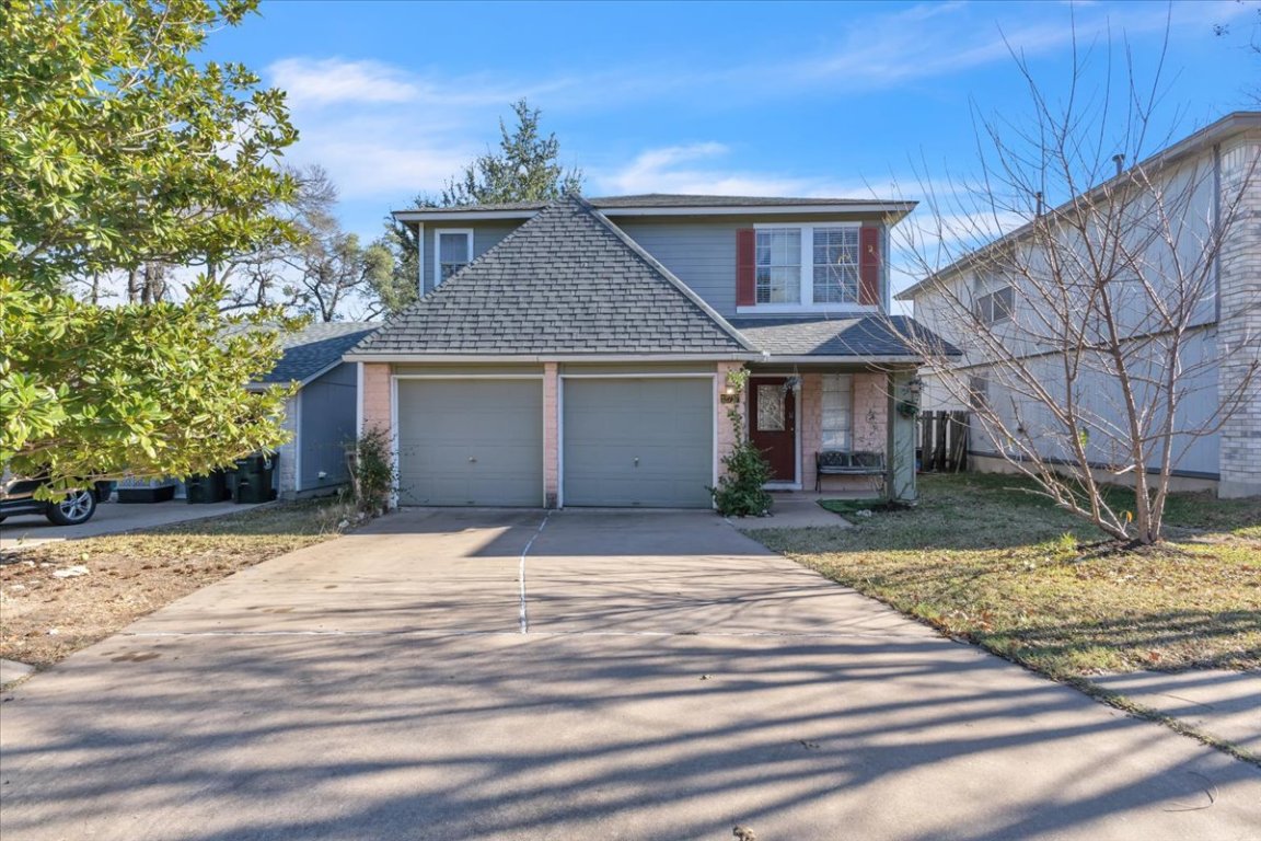 12717 Modena Trail Austin, TX 78729 - Photo 3 of 30 a front view of a house with a yard