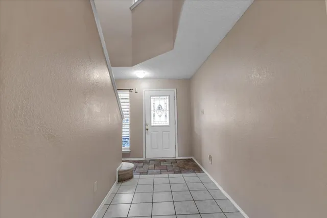 a view of an empty room and window