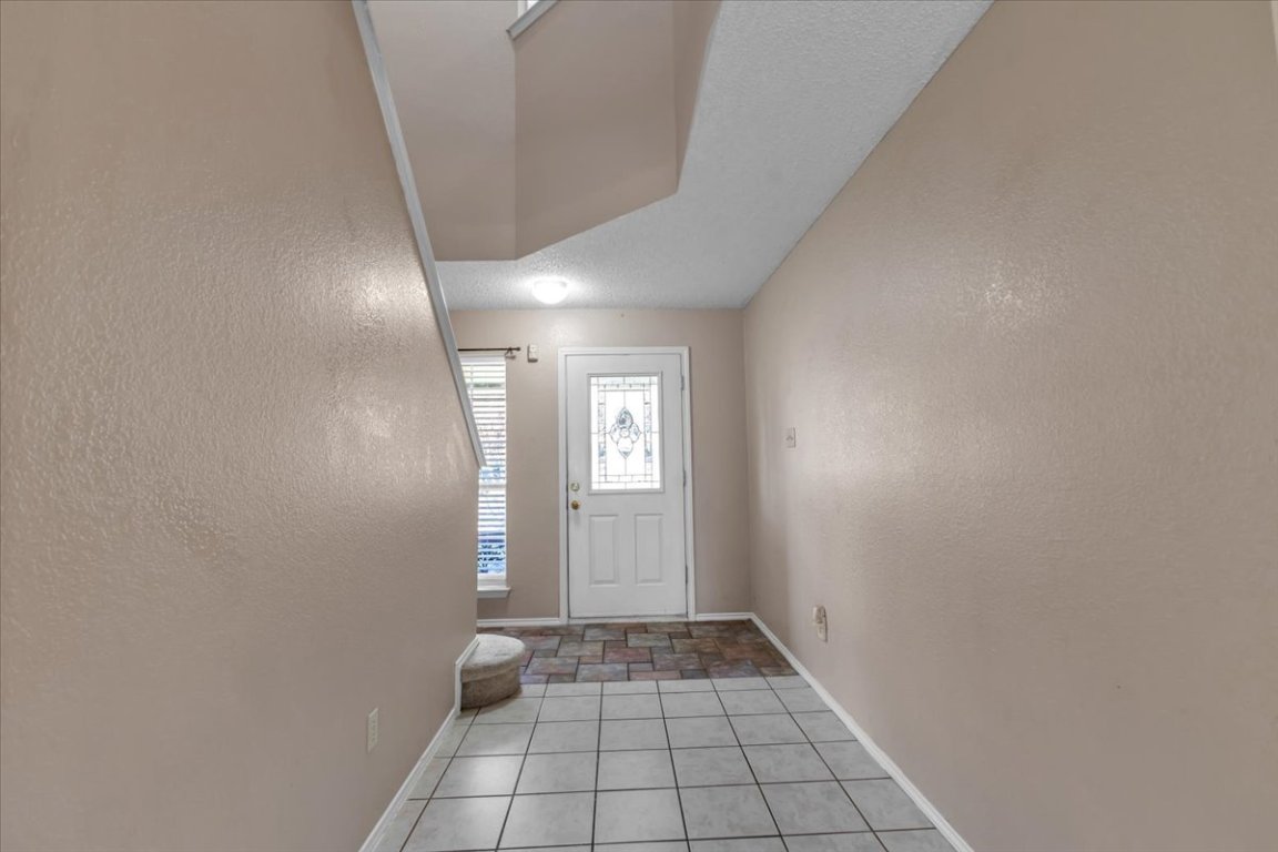 12717 Modena Trail Austin, TX 78729 - Photo 7 of 30 a view of an empty room and window