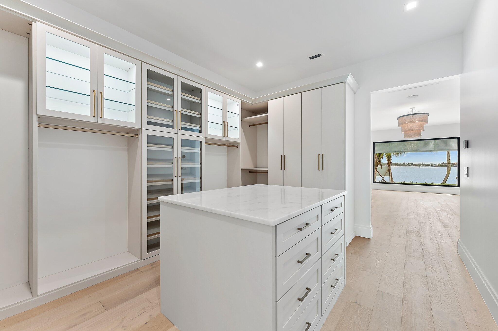 21 Bay Harbor Road Tequesta, FL 33469 - Photo 52 of 89 a kitchen with a cabinets and a stove top oven