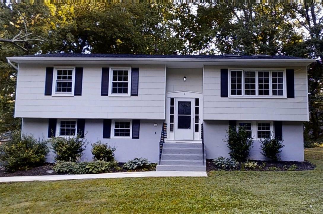 front view of a house with a yard