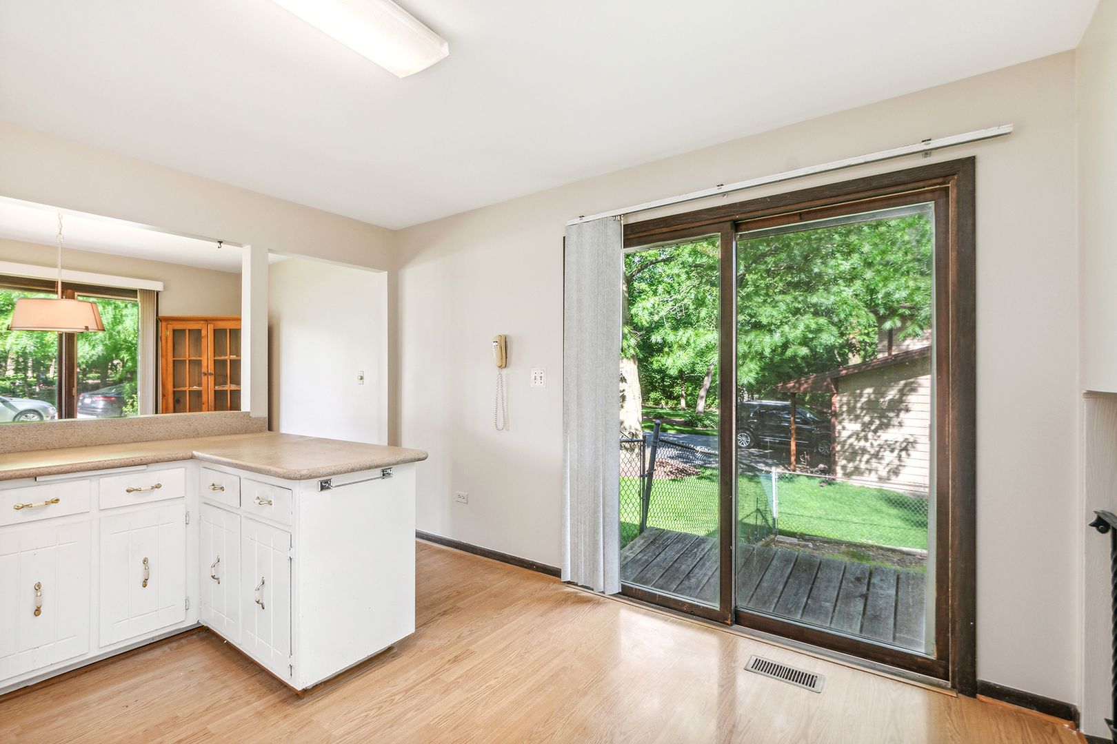 552 Hackberry Road Frankfort, IL 60423 - Photo 8 of 22 a view of a kitchen with wooden floor and doors