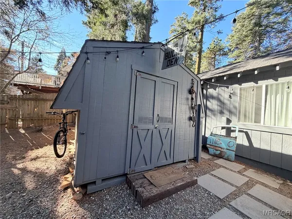 a view of backyard with tub and trees around