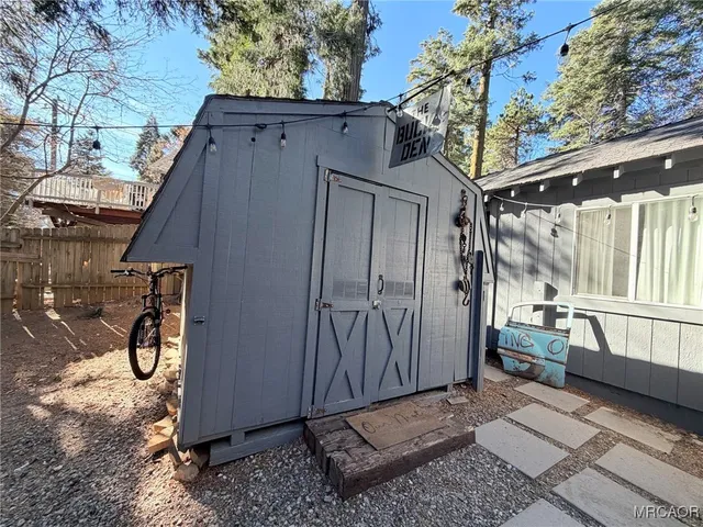 a view of backyard with tub and trees around
