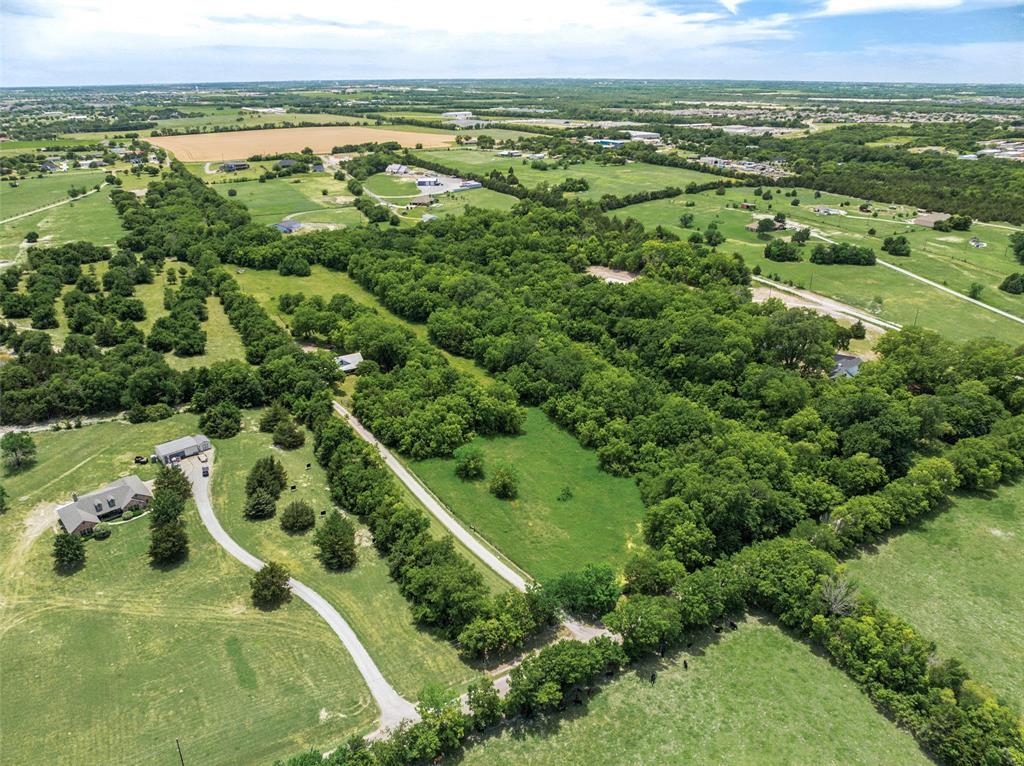 1000 Ballard Road Van Alstyne, TX 75495 - Photo 36 of 40 an aerial view of residential houses with outdoor space and trees
