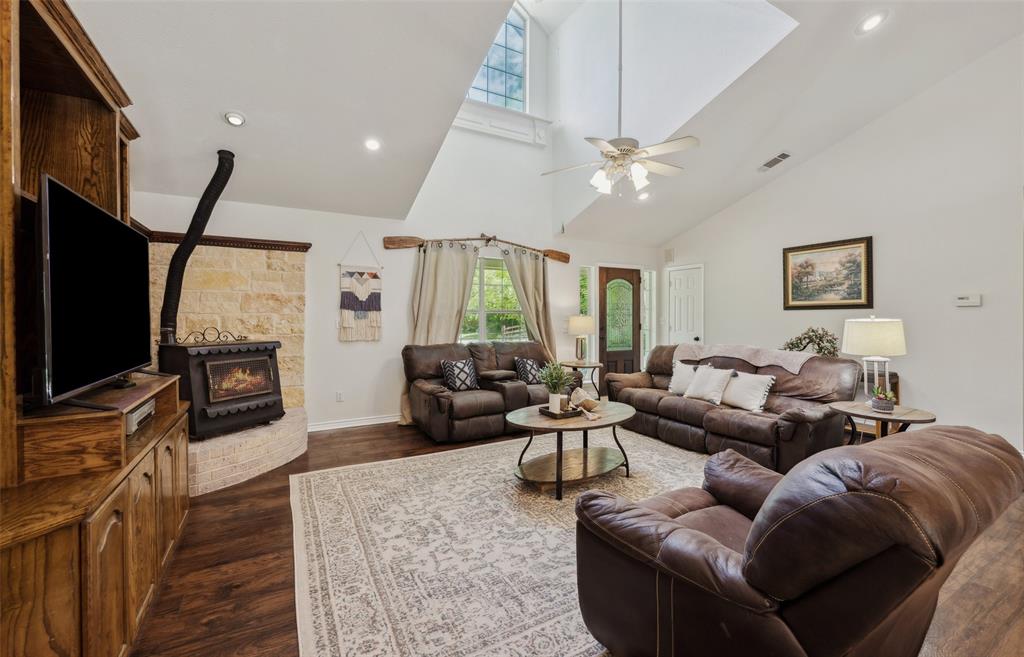1000 Ballard Road Van Alstyne, TX 75495 - Photo 10 of 40 a living room with furniture a ceiling fan and a flat screen tv