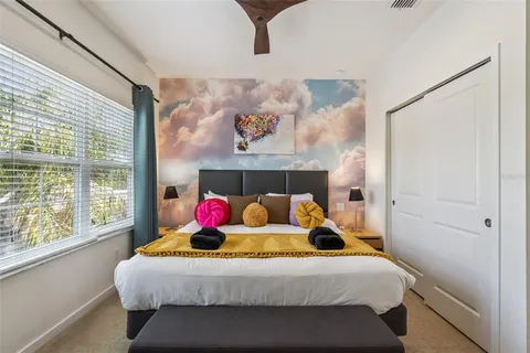 a bedroom with a bed and window