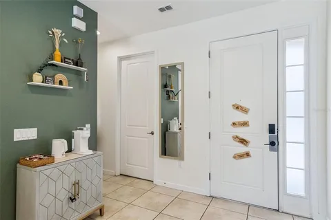 walk in closet with view of bathroom