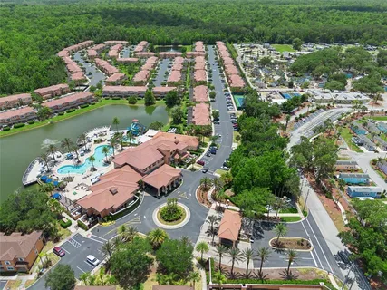 an aerial view of a house with a lake view