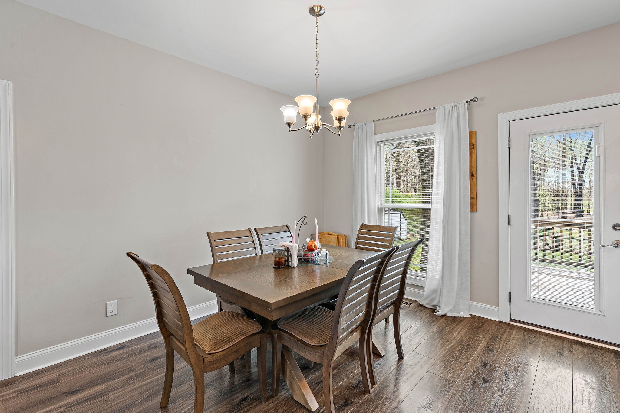 4233 Old Coopertown Road Springfield, TN 37172 - Photo 8 of 28 a dining room with furniture wooden floor and a chandelier