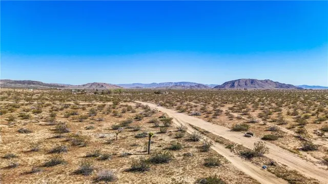 a view of a mountain with a mountain in the background