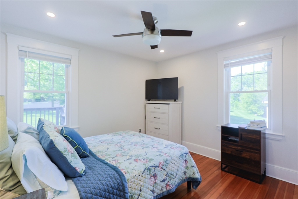 22 Stubb Street, Unit 1 Franklin, MA 02038 - Photo 13 of 42 a bedroom with a bed and a flat screen tv