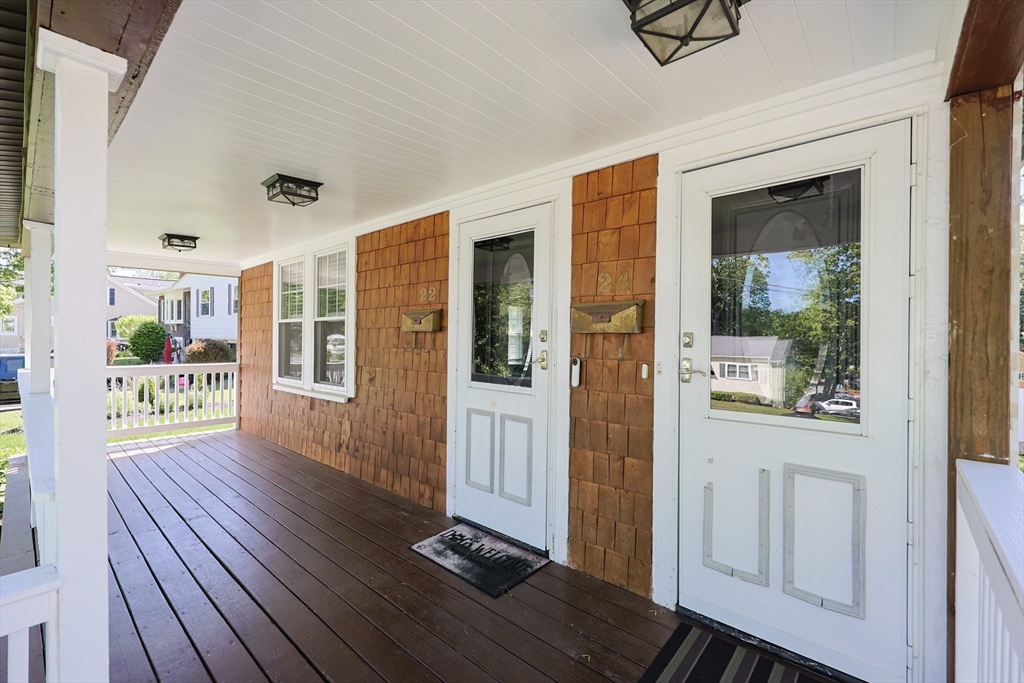 22 Stubb Street, Unit 1 Franklin, MA 02038 - Photo 2 of 42 a view of an entryway with wooden floor and door