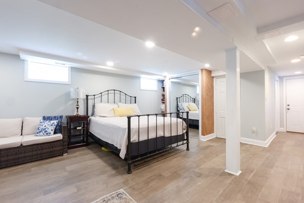 22 Stubb Street, Unit 1 Franklin, MA 02038 - Photo 25 of 42 a bedroom with a bed and a walk in closet