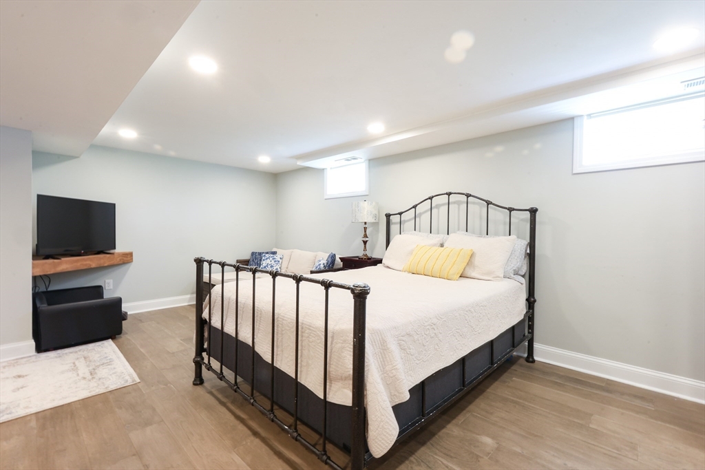 22 Stubb Street, Unit 1 Franklin, MA 02038 - Photo 27 of 42 a bed room with a bed and a television