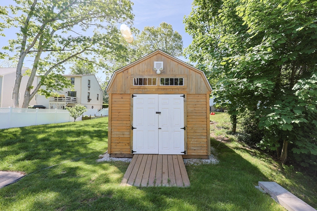 22 Stubb Street, Unit 1 Franklin, MA 02038 - Photo 31 of 42 a view of a house with a yard