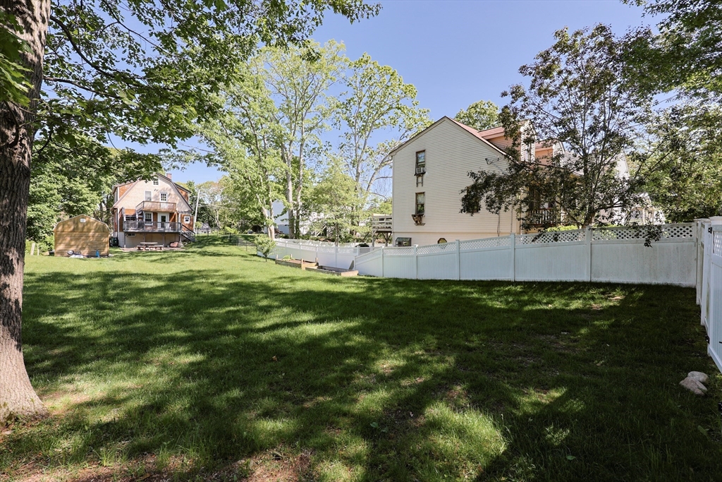 22 Stubb Street, Unit 1 Franklin, MA 02038 - Photo 37 of 42 a view of yard with outdoor seating and green space