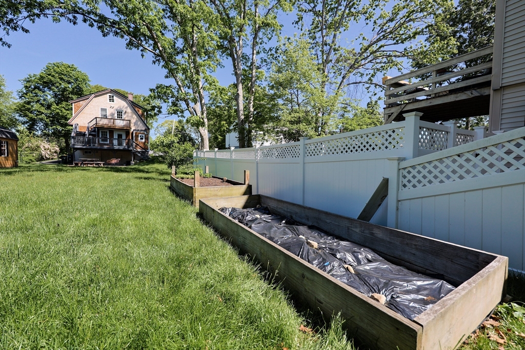 22 Stubb Street, Unit 1 Franklin, MA 02038 - Photo 39 of 42 a view of a small house in the back yard