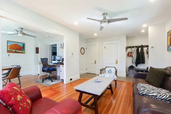 a workspace with furniture and a chandelier