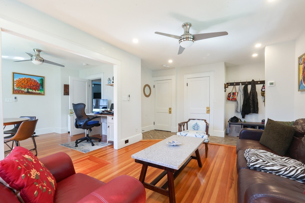 22 Stubb Street, Unit 1 Franklin, MA 02038 - Photo 6 of 42 a workspace with furniture and a chandelier