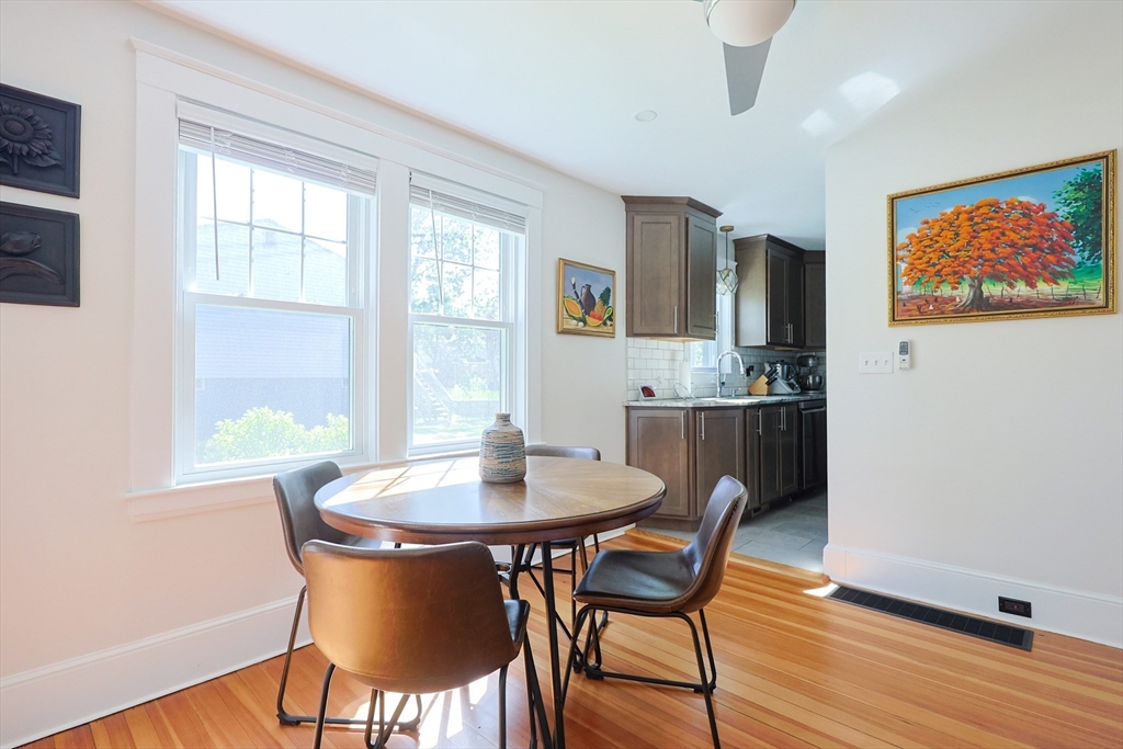 22 Stubb Street, Unit 1 Franklin, MA 02038 - Photo 8 of 42 a dining room with furniture and wooden floor