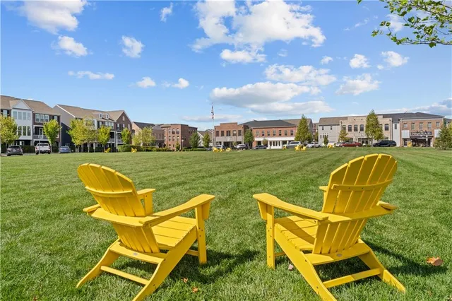 a view of a swimming pool and lounge chairs
