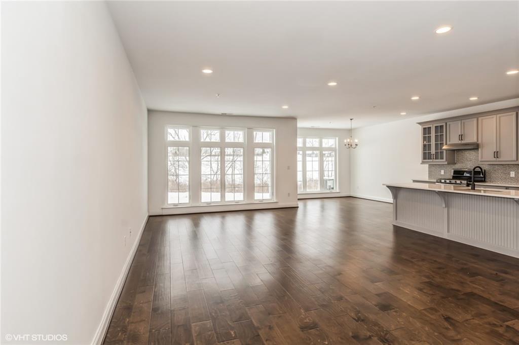616 Gratitude Road Cranberry Township, PA 16066 - Photo 4 of 39 a view of an empty room with wooden floor and a window