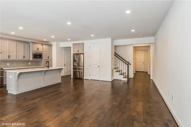 a view of kitchen with cabinets and wooden floor