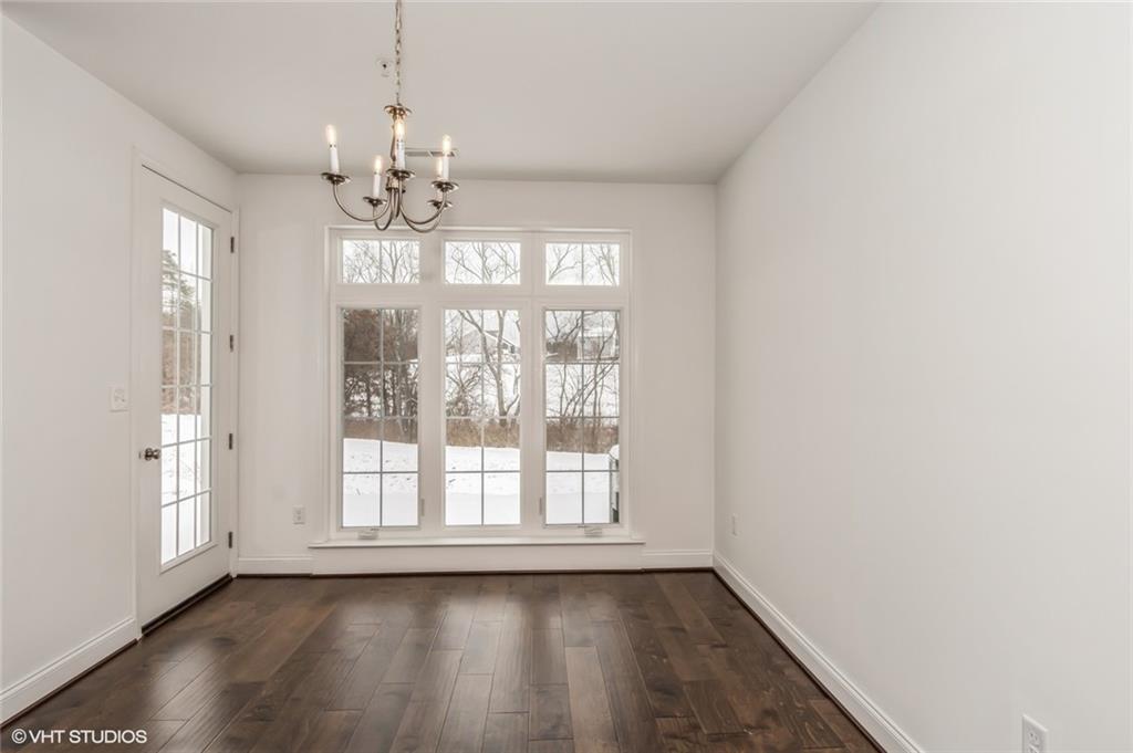 616 Gratitude Road Cranberry Township, PA 16066 - Photo 9 of 39 a view of an empty room with wooden floor and a window