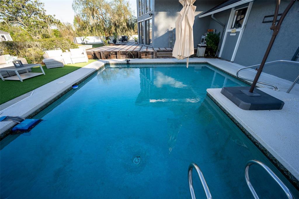 9807 Wedgewood Lane Leesburg, FL 34788 - Photo 17 of 90 a view of an house with swimming pool