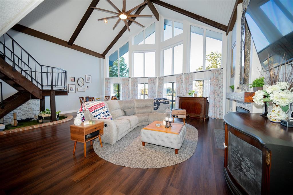 9807 Wedgewood Lane Leesburg, FL 34788 - Photo 67 of 90 a living room with furniture a table and large windows