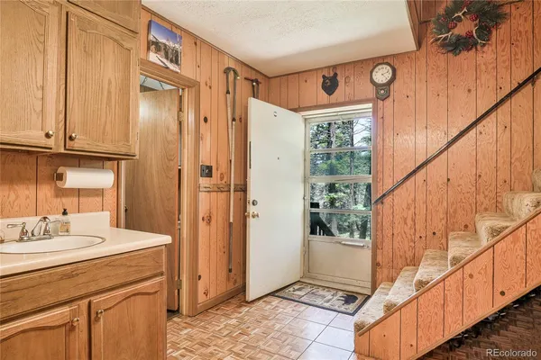 a bathroom with a sink a mirror and a shower