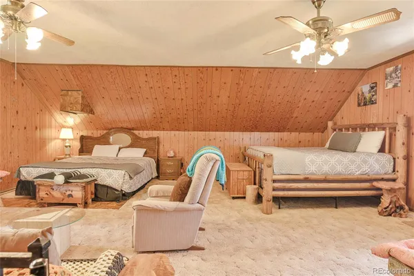 a living room with furniture and a lamp