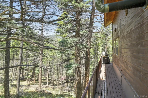 a view of a balcony with a tree