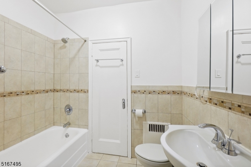 10 North Ridgewood Road, Unit 114 South Orange, NJ 07079 - Photo 10 of 15 a bathroom with a bathtub and shower