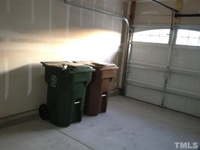 a front view of a house with a garden and yard