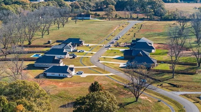 an aerial view of a house having yard