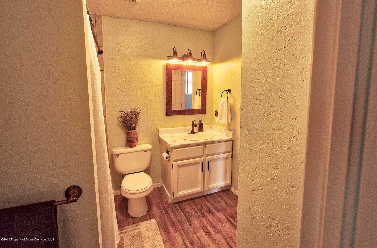 1017 Arnold Court Rifle, CO 81650 - Photo 16 of 28 a bathroom with a sink a toilet and mirror